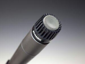 High-quality close-up of a dynamic microphone for audio recording and performance.