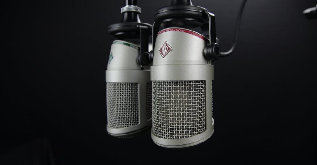 Close-up of two professional microphones in a recording studio, ideal for podcasts and music production.